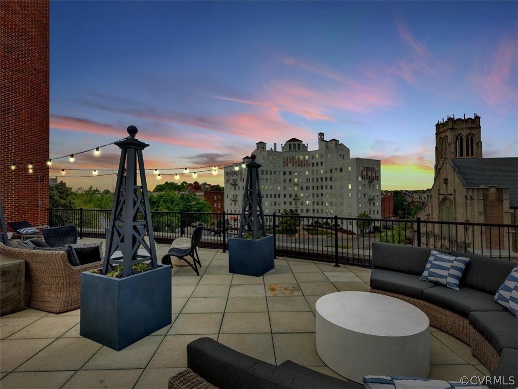 413 Stuart Circle, Unit UPLC Richmond, VA 23220 - Photo 24 of 36 a view of a roof deck with couches and potted plants
