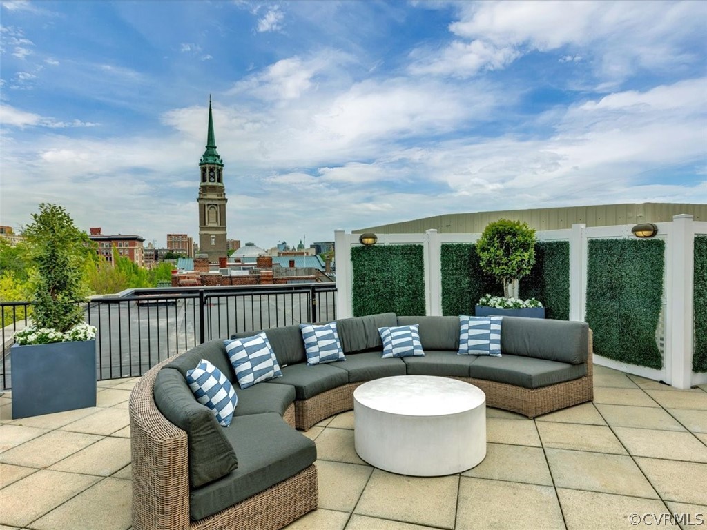 413 Stuart Circle, Unit UPLC Richmond, VA 23220 - Photo 27 of 36 a roof deck with couches and potted plants