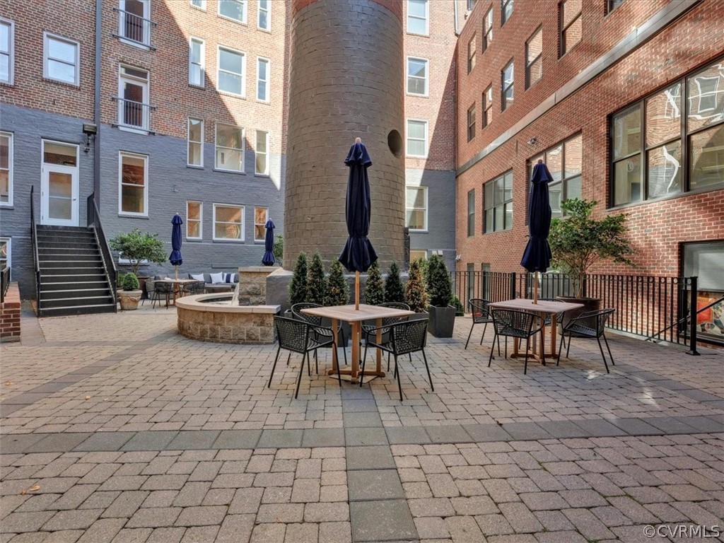 413 Stuart Circle, Unit UPLC Richmond, VA 23220 - Photo 32 of 36 a view of a patio with table and chairs