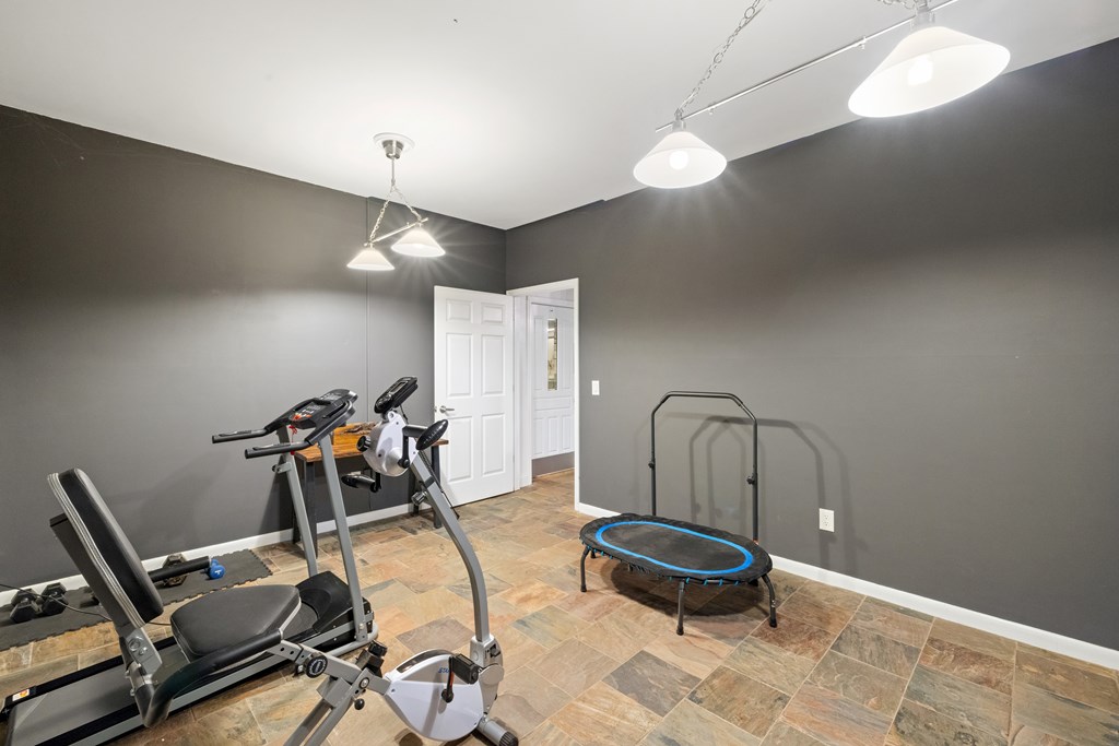3800 Cutcane Road Mineral Bluff, GA 30559 - Photo 34 of 68 a room with gym equipment and a window