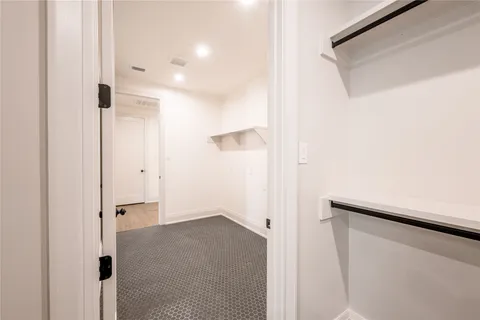 a bathroom with a shower and a glass door