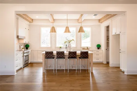 a dining room with furniture and wooden floor