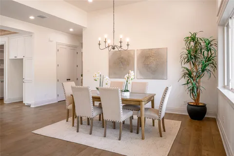 a view of a dining room with furniture window and flowerpot