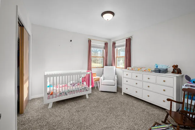 a bedroom with furniture and a window