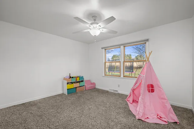 a room with toys and a wooden floor