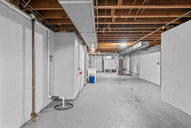 a view of a table and chairs on the roof deck
