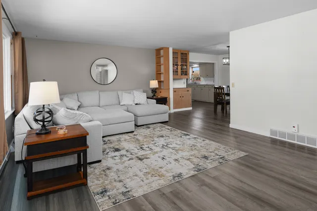 a living room with furniture and a table