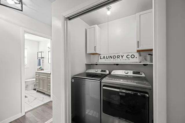 a utility room with washer and dryer