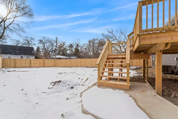 a view of a yard with a snow on the road