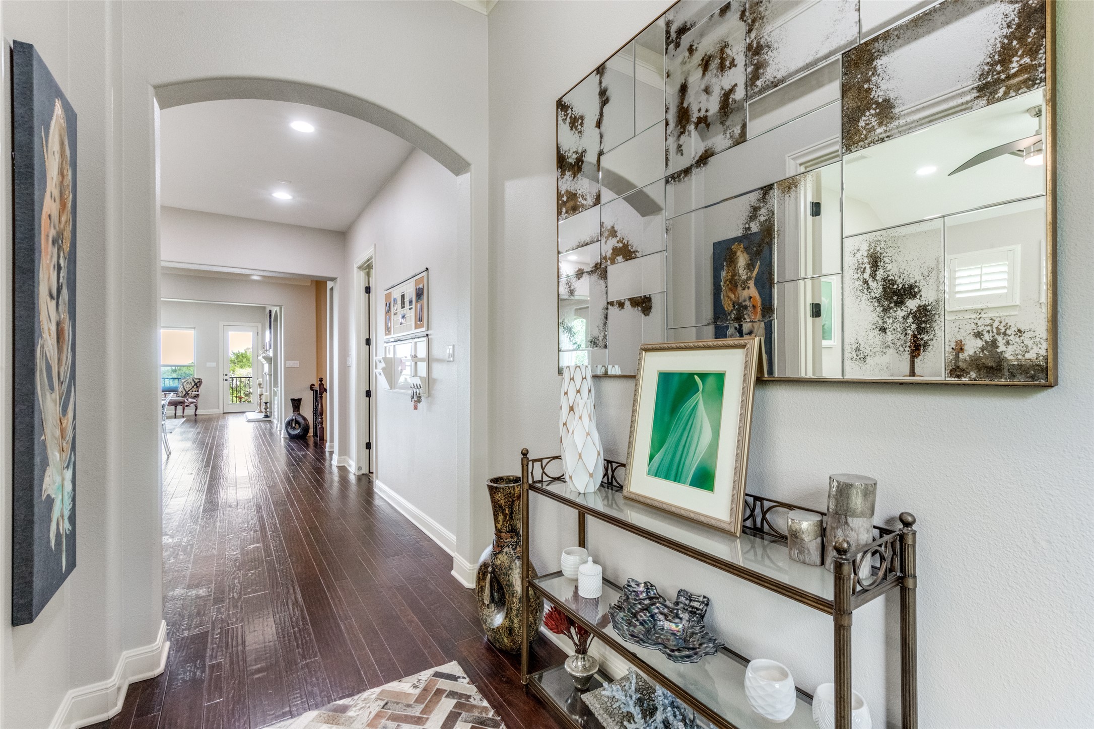 2312 Rivina Drive Austin, TX 78733 - Photo 24 of 40 Hall featuring arched walkways, dark wood-style flooring, and recessed lighting