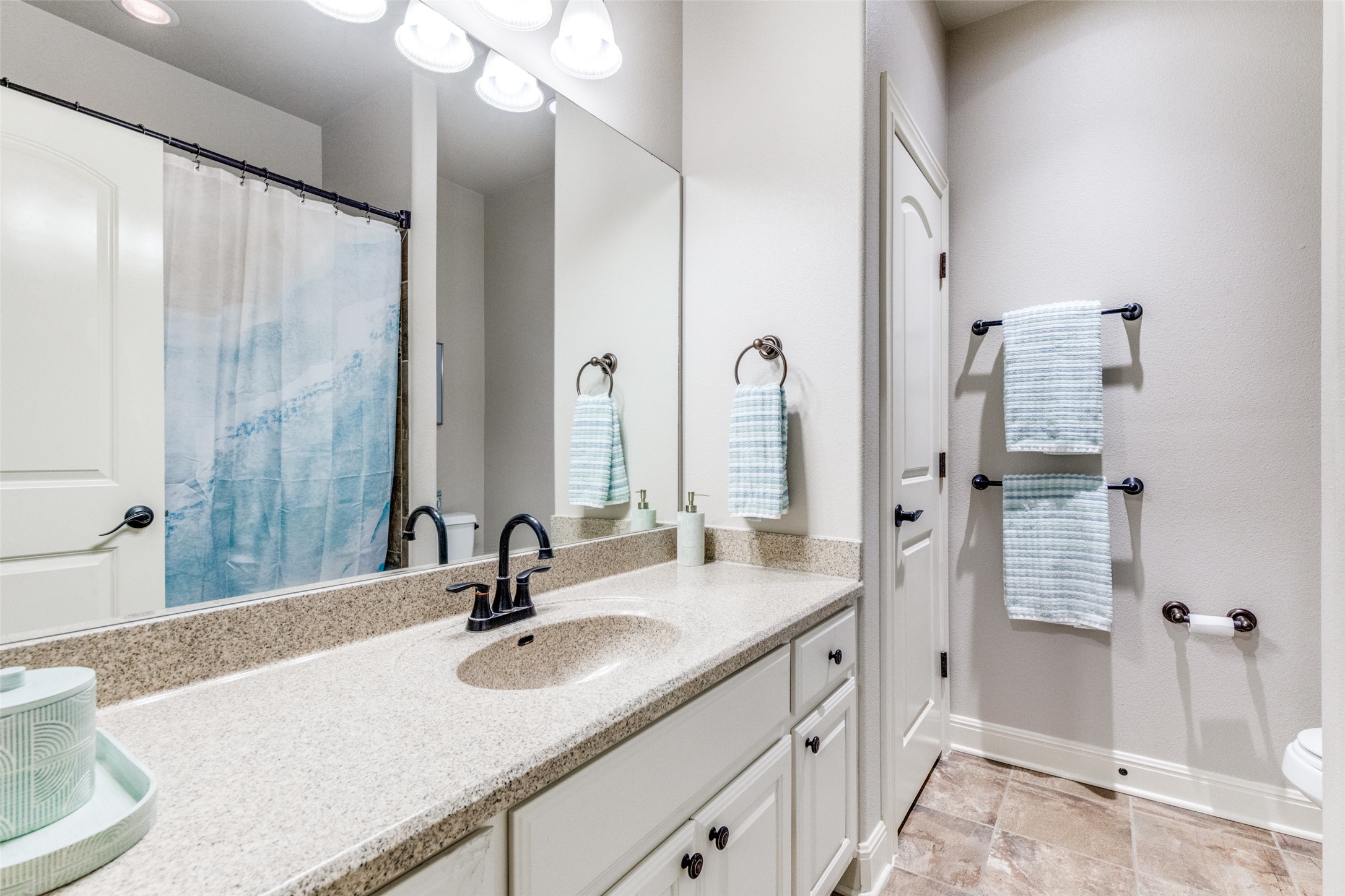 2312 Rivina Drive Austin, TX 78733 - Photo 35 of 40 Kid's bathroom features tub and shower combo