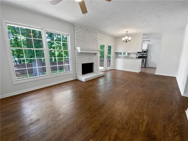 a view of kitchen with furniture and wooden floor