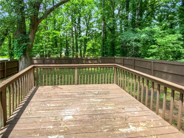 a view of balcony with yard