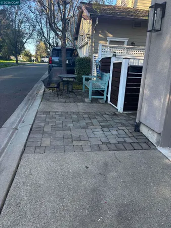 a view of house with outdoor space and seating area