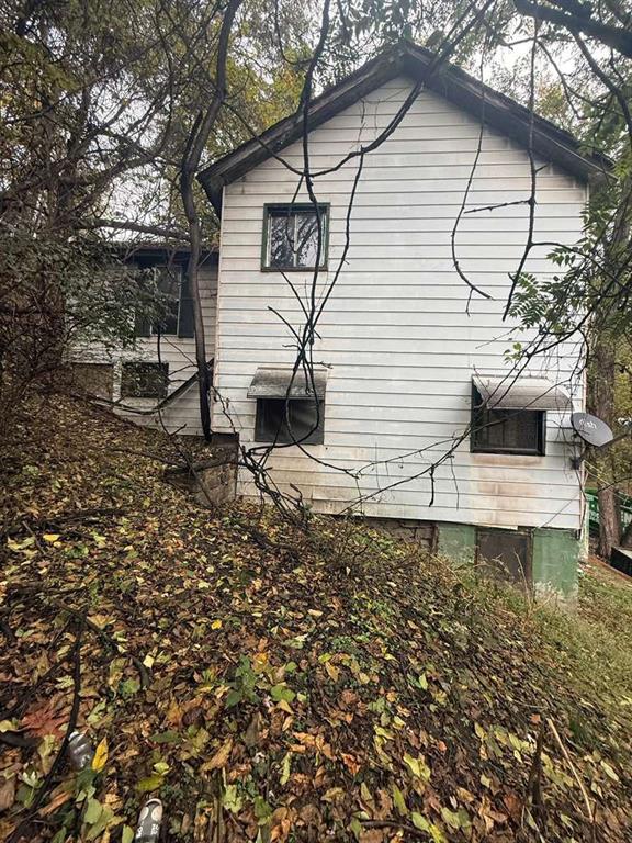 126 Howard Street Monongahela, PA 15063 - Photo 4 of 5 a white house with a small yard and large trees