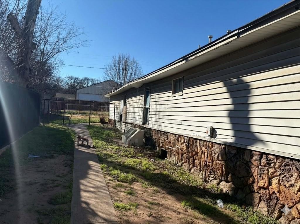 710 Shawnee Street Graham, TX 76450 - Photo 14 of 15 a front view of a house with a yard