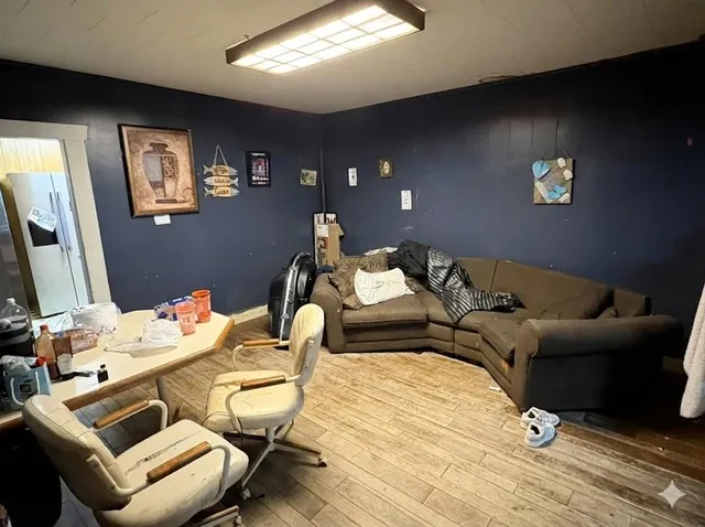 a balcony with furniture and wooden floor