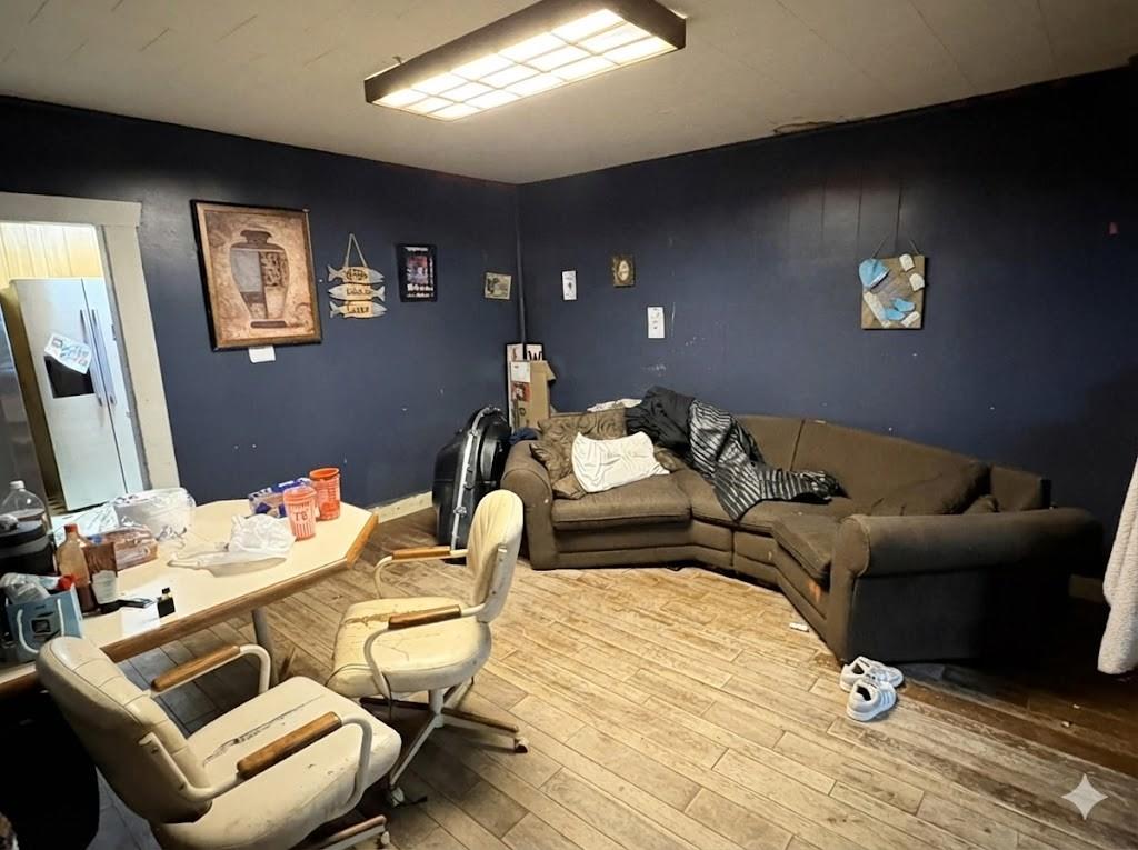 710 Shawnee Street Graham, TX 76450 - Photo 3 of 15 a balcony with furniture and wooden floor