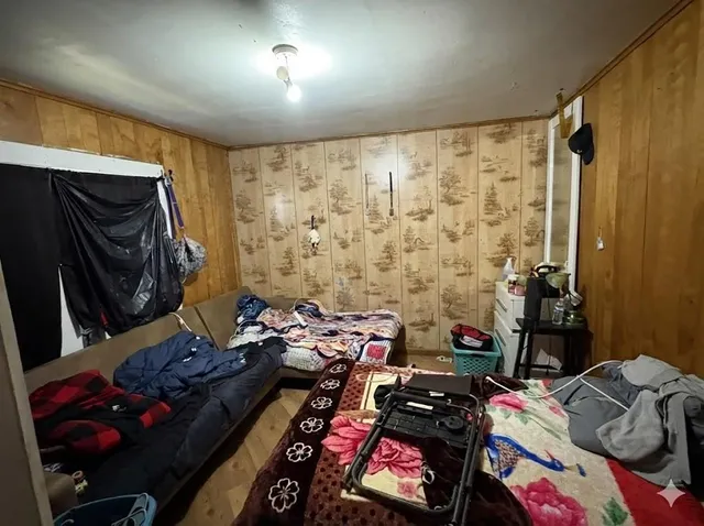 a room with furniture and a flat screen tv