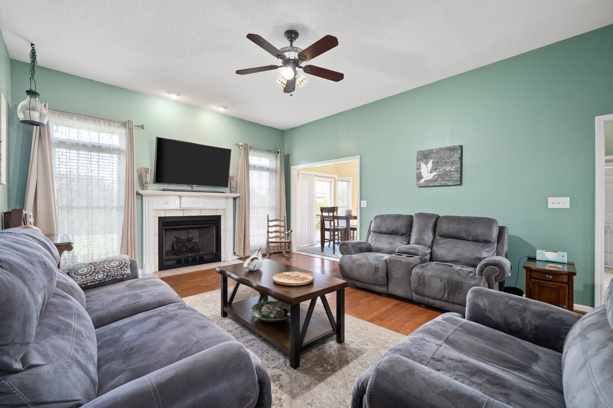 3880 Head Road Adams, TN 37010 - Photo 6 of 41 a living room with furniture a fireplace and a flat screen tv