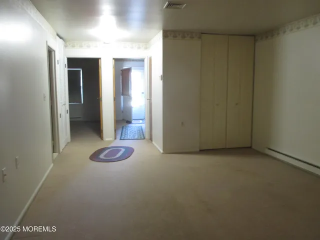 a kitchen with granite countertop a sink and a microwave