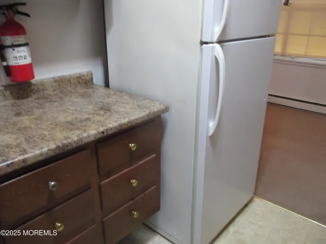a bathroom with a sink a toilet a shower curtain and a mirror