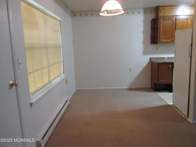 a view of a room that has a window in it