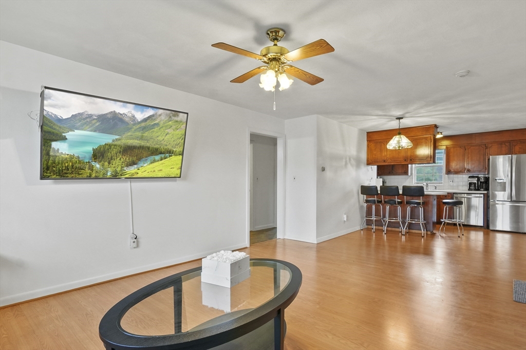 132 Parker Street, Unit G5 Acton, MA 01720 - Photo 12 of 22 a dining room with furniture and wooden floor