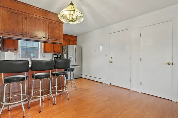 a view of a dining room with furniture and chandelier