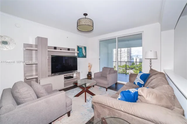 a view of a dining room with furniture wooden floor and chandelier