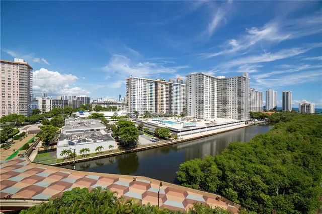a view of a patio with table and chairs and potted plants