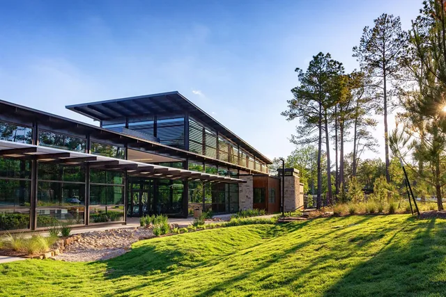 a view of a house with backyard porch and sitting area