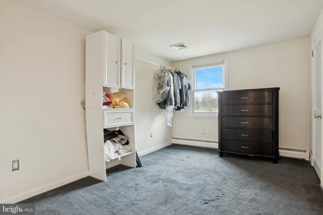 a view of a bedroom with closet