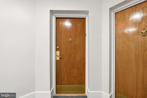 a view of bathroom with a door and a shower