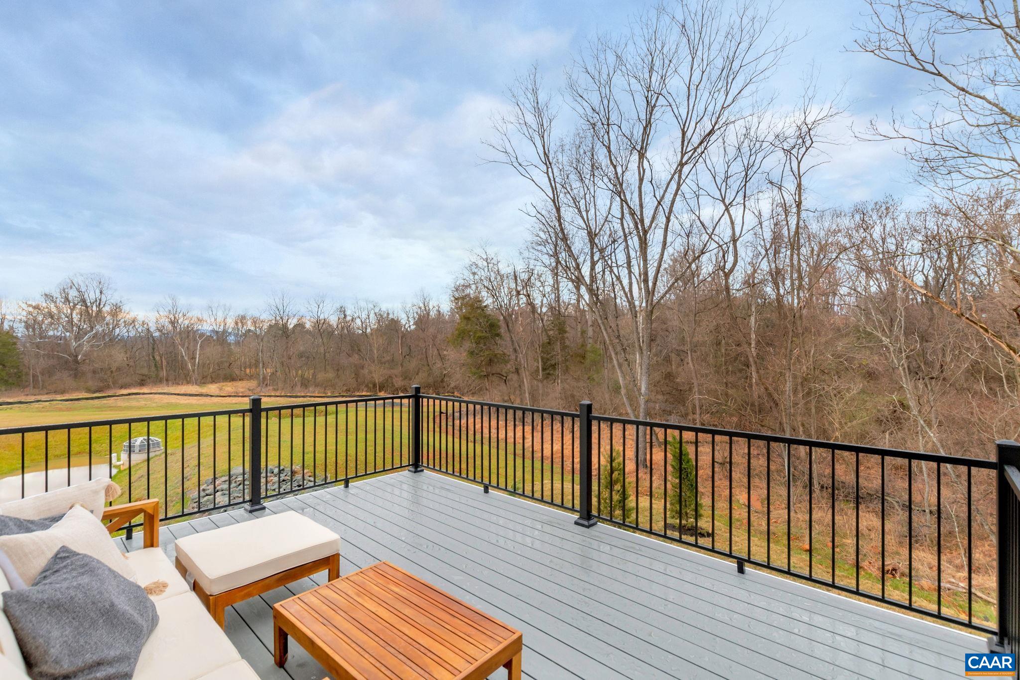 3059 Rambling Brk Lane Crozet, VA 22932 - Photo 11 of 30 a view of a balcony with wooden floor and wooden fence