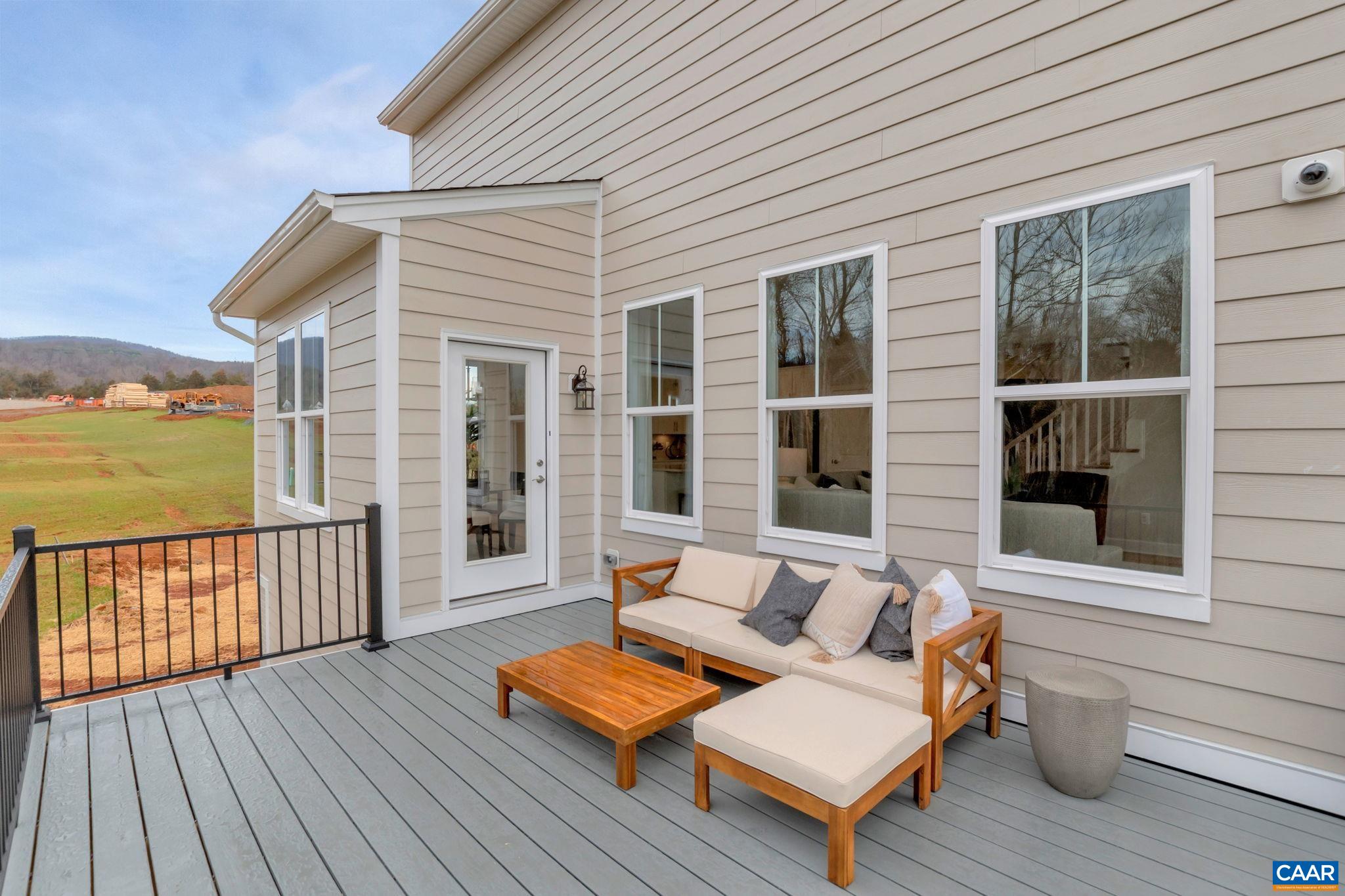 3059 Rambling Brk Lane Crozet, VA 22932 - Photo 12 of 30 a view of a roof deck with wooden floor and outdoor seating