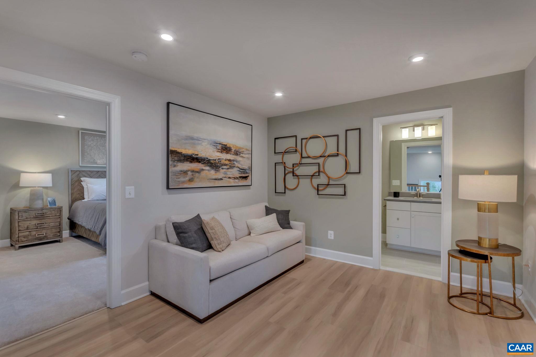 3059 Rambling Brk Lane Crozet, VA 22932 - Photo 16 of 30 a living room with furniture and a wooden floor
