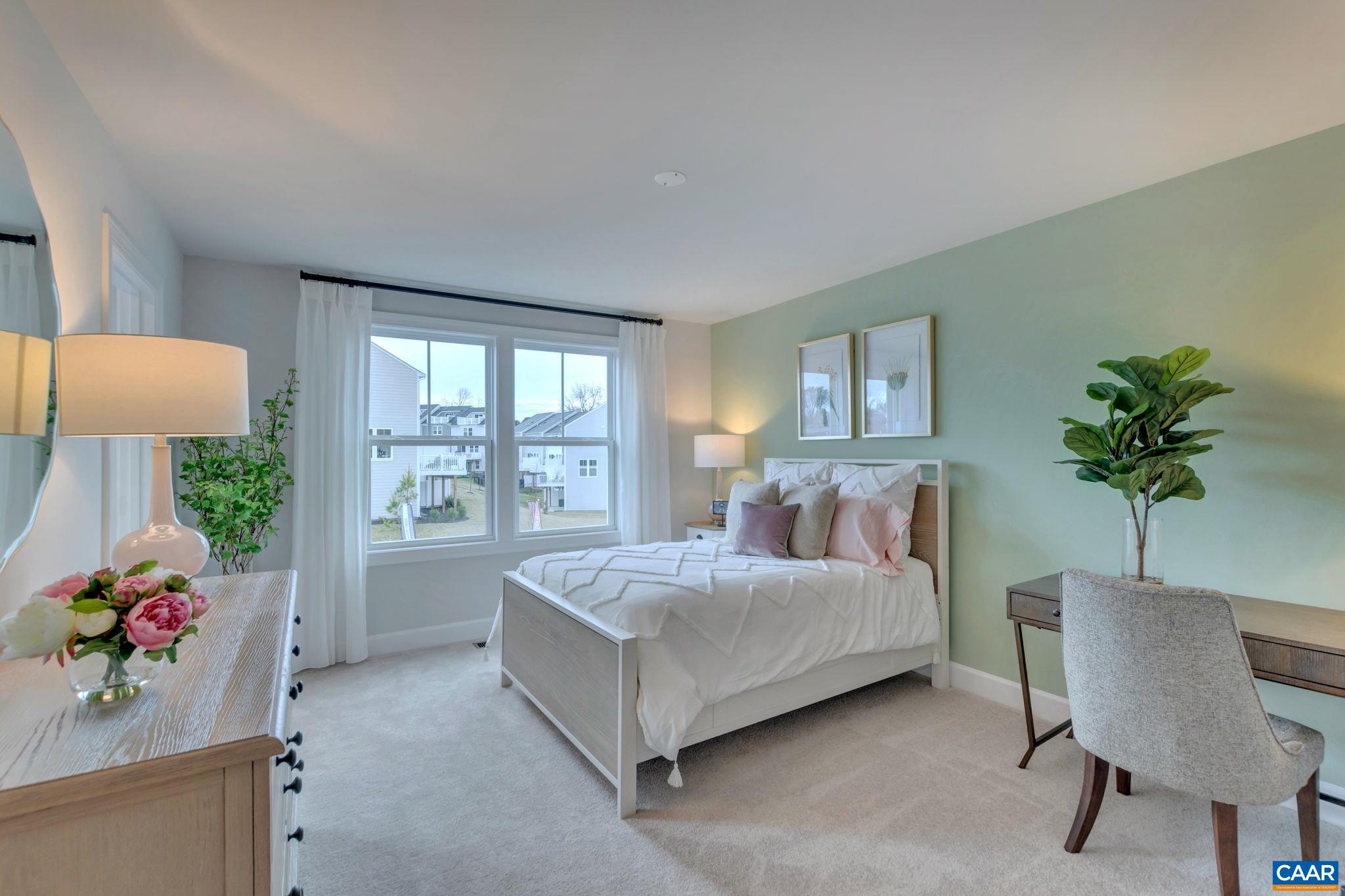 3059 Rambling Brk Lane Crozet, VA 22932 - Photo 23 of 30 a living room with a bed furniture and a potted plant
