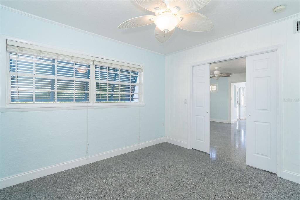 2835 North Beach Road, Unit A Englewood, FL 34223 - Photo 20 of 58 an empty room with a window