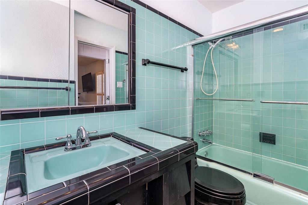 2835 North Beach Road, Unit A Englewood, FL 34223 - Photo 28 of 58 a bathroom with a sink and a mirror