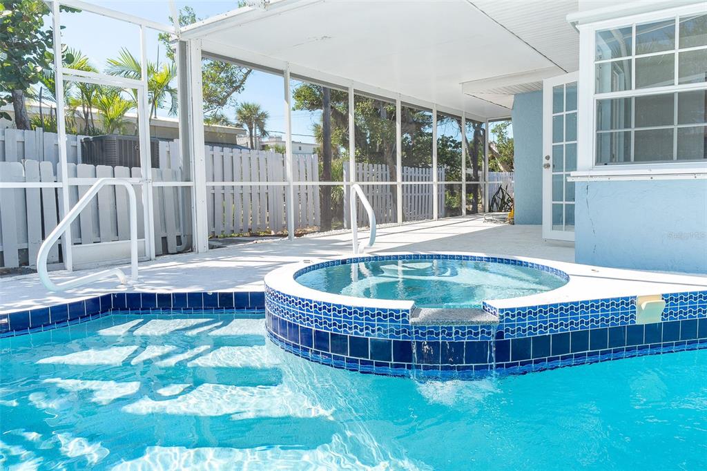 2835 North Beach Road, Unit A Englewood, FL 34223 - Photo 35 of 58 a view of a house with a tub and wooden floor
