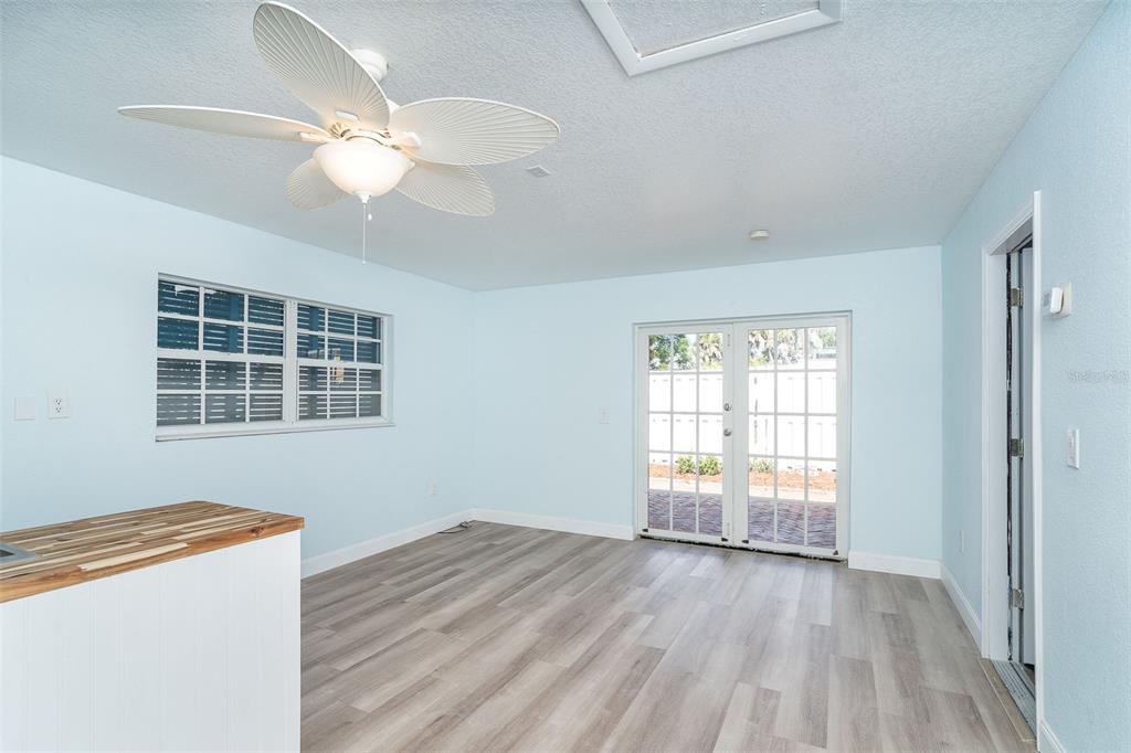 2835 North Beach Road, Unit A Englewood, FL 34223 - Photo 40 of 58 wooden floor in an empty room with a window