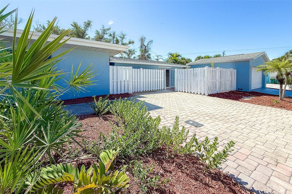 2835 North Beach Road, Unit A Englewood, FL 34223 - Photo 8 of 58 a view of a backyard with wooden fence