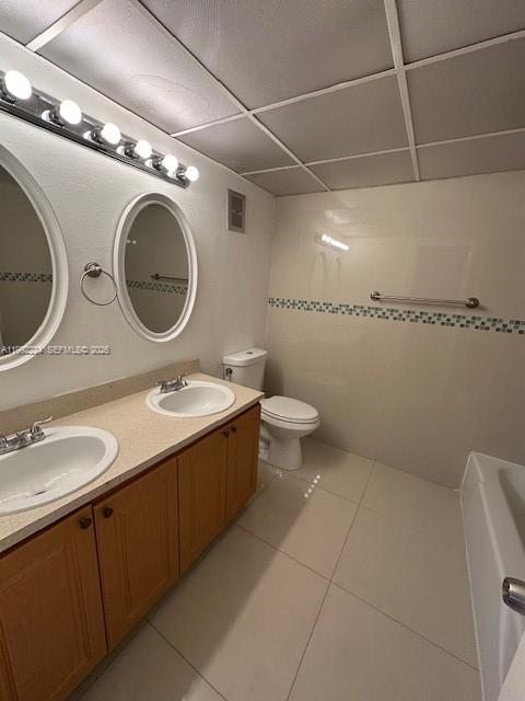 5400 Southwest 77th Court, Unit 2R Miami, FL 33155 - Photo 12 of 16 a bathroom with a sink and a mirror
