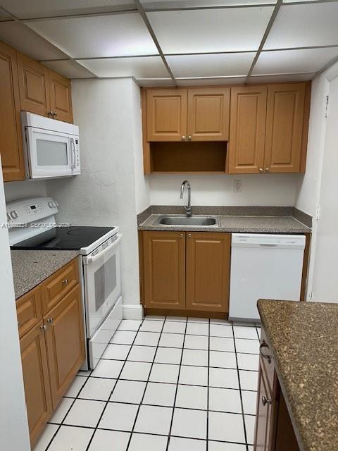 5400 Southwest 77th Court, Unit 2R Miami, FL 33155 - Photo 6 of 16 a kitchen with a sink a stove cabinets and a counter top space