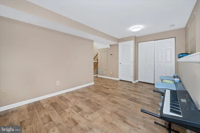 a roof deck with a table and chairs