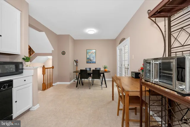 a view of a dining room with furniture and a window