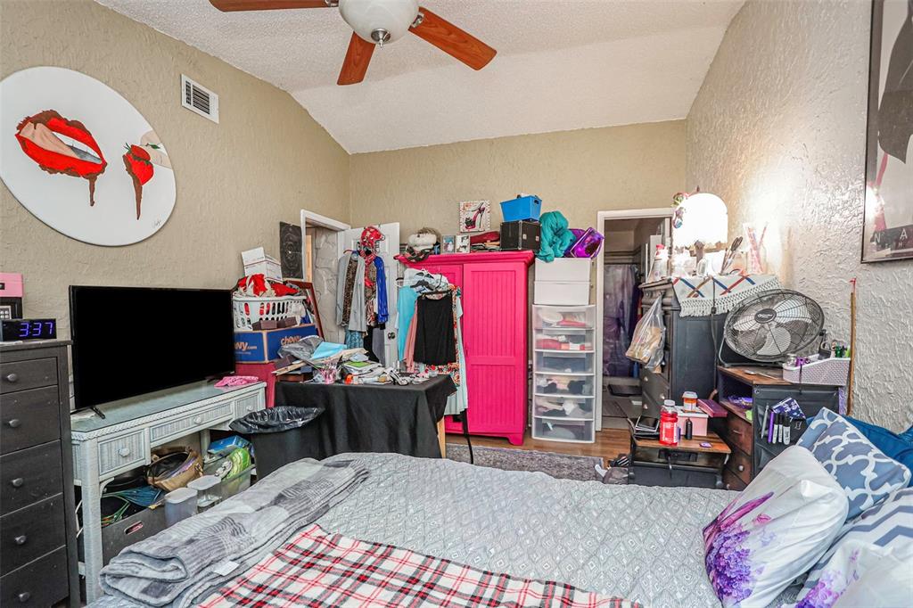 10039 88th Street Seminole, FL 33777 - Photo 19 of 44 a living room with lots of furniture and a flat screen tv