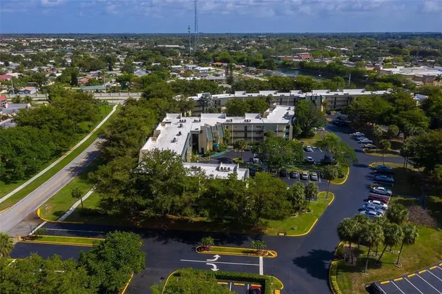 an aerial view of residential house with outdoor space and swimming pool