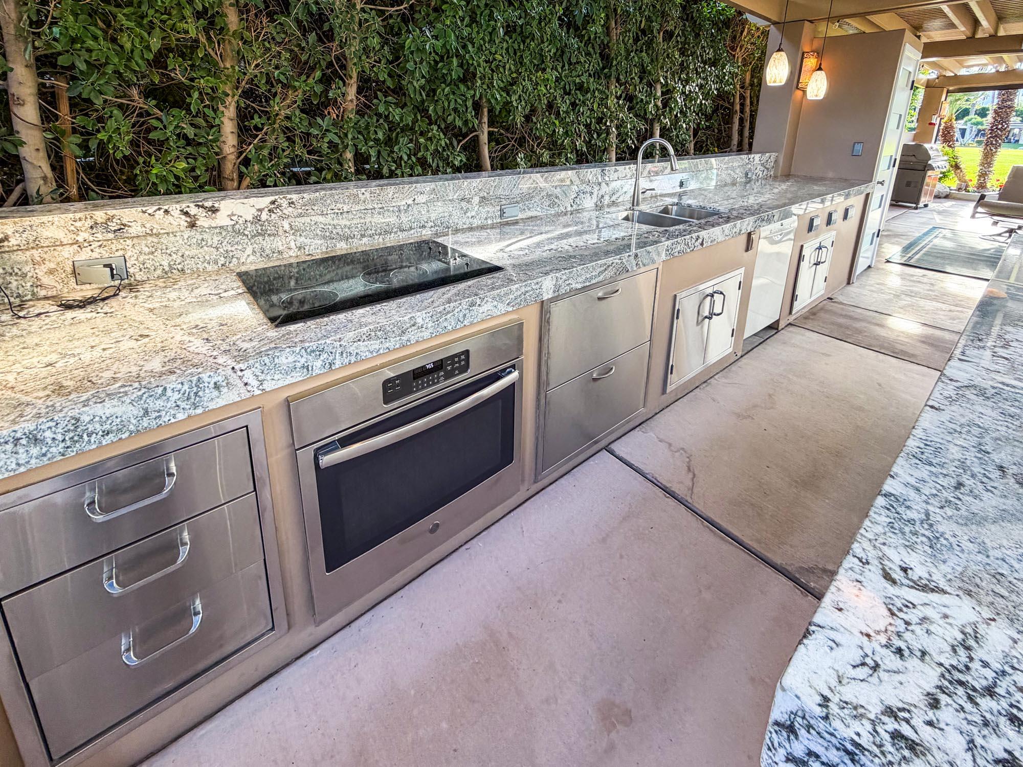 80394 Ave 48, Unit 298 Indio, CA 92201 - Photo 3 of 25 a kitchen with granite countertop a sink and a stove